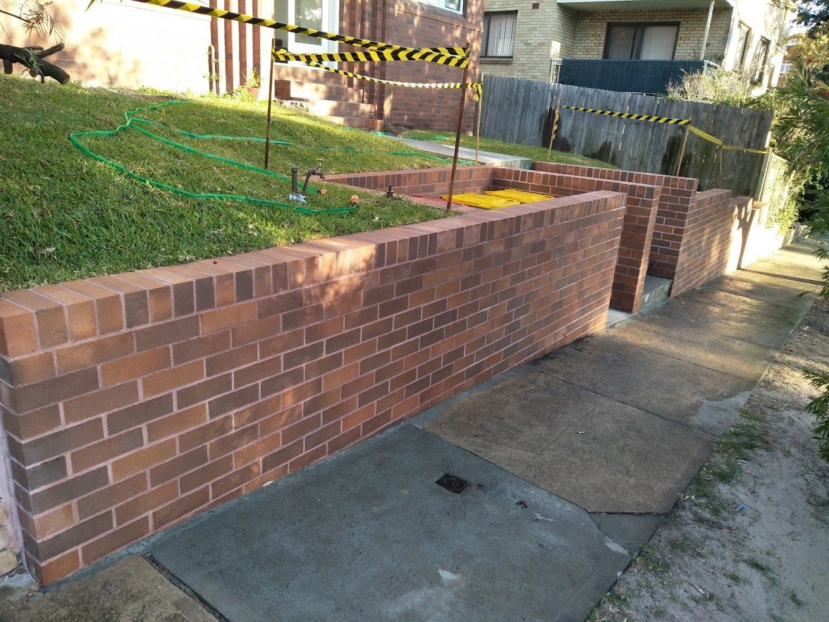 Retaining wall, bin enclosure and brick fence — Maroubra